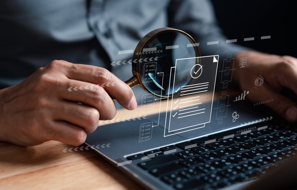 Analyst reviewing financial performance data on a laptop